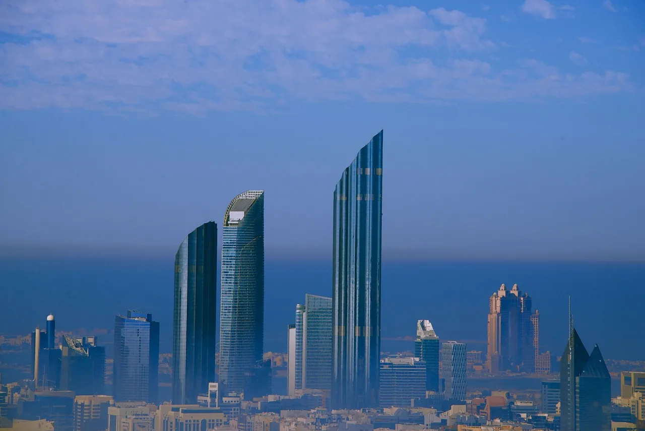 Glass residential and office towers in Abu Dhabi above the sea