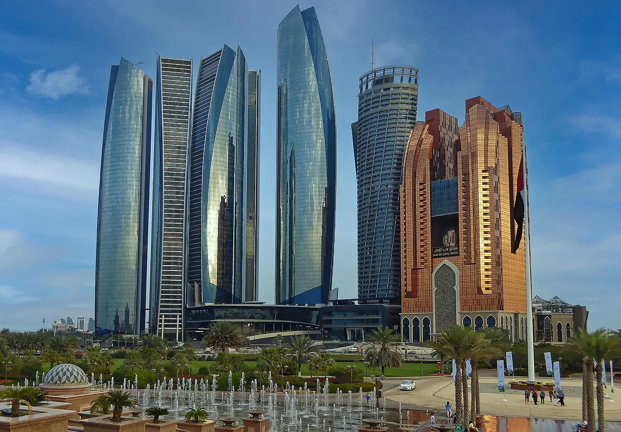 Curved glass towers and a hotel in Abu Dhabi on a sunny day